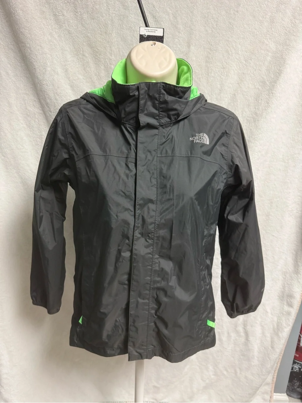 The North Face Kids Black Raincoat with Neon Green Lining